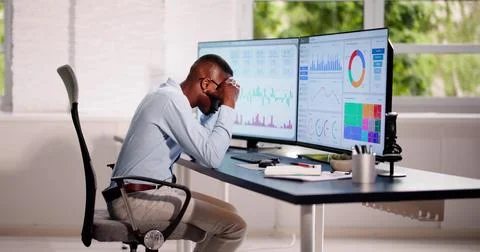 Data Analyst African Man Using Spreadsheet Stock Photos