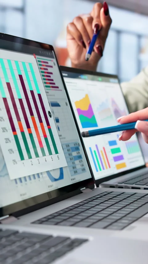 Data Analyst And Financial Consultant Reviewing Market Dashboard Insights Stock Footage 343886399