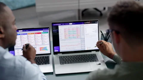 Data Analyst And Manager Review AI Model Risk On Laptop Stock Footage 346321799