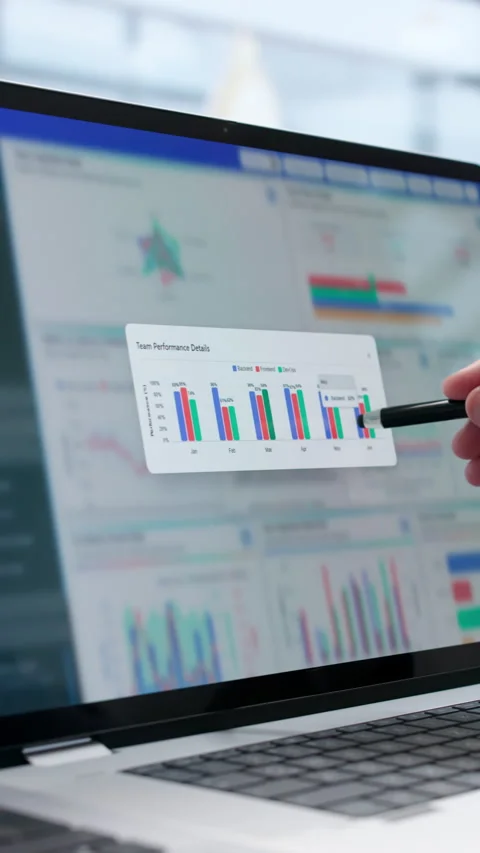 Data Analyst Carefully Monitors Financial KPIs On Laptop Stock Footage 340399313