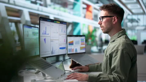 Data Analyst Carefully Reviewing Financial Dashboard Stock Footage 340398181