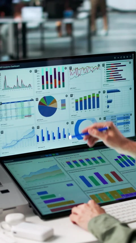 Data Analyst Carefully Reviewing Financial Dashboard Stock Footage 340399881