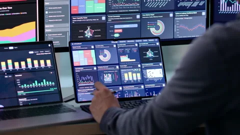 Data Analyst Carefully Studies Dashboard Metrics On Laptop Stock Footage 339889935