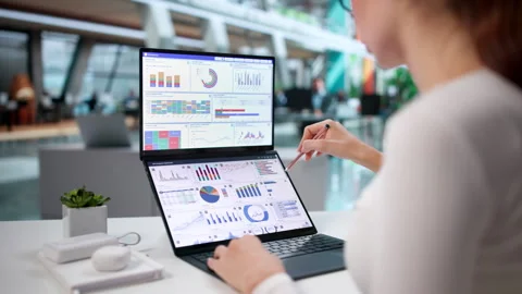Data Analyst Carefully Studies Financial Dashboard Stock Footage 343889053