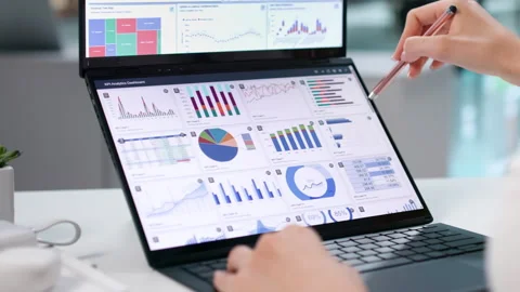 Data Analyst Carefully Studies Financial Dashboard Stock Footage 344715029