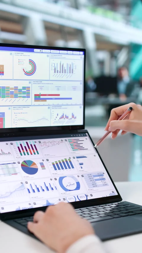 Data Analyst Carefully Studies Financial Dashboard 動画素材 345861626