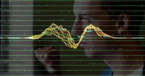 Data analyst in dark jacket studying green grid and annotated waveforms in Stock Photos