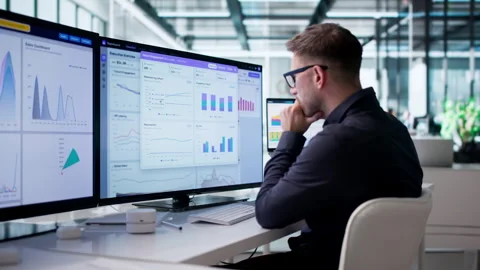 Data Analyst Focused Intently On Dashboard Stock Footage 340397327