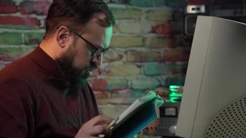 Data Analyst in Front of Computer From 1990's Looking at Paper Documents and Stock Footage 306146702
