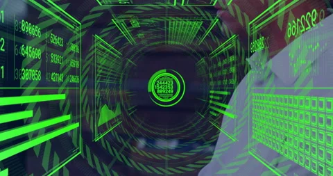 Data analyst interacting with tech control room interface, displaying green Stock Footage 307435399