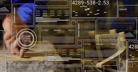 Data analyst jotting notes at office desk, with pen notebooks laptop wristwatch 스톡 사진