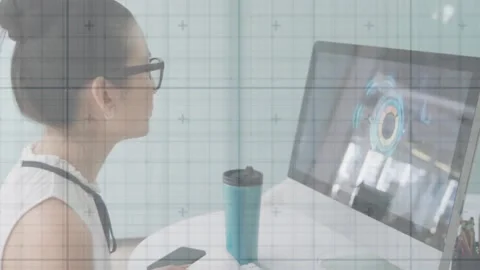 Data analyst maintaining gaze on chart update grabbing smartphone for checking Stock Footage 326765589