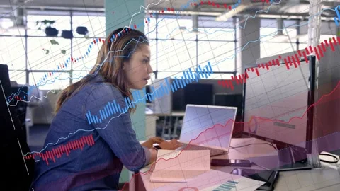 Data analyst placing pages at desk, comparing screen graphs with animated charts Stock Footage 333211089