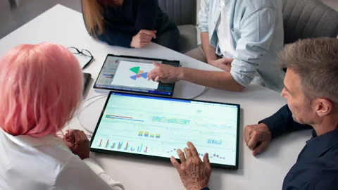 Data Analyst Presenting Technology Solutions To Diverse Team Stock Footage 332902350