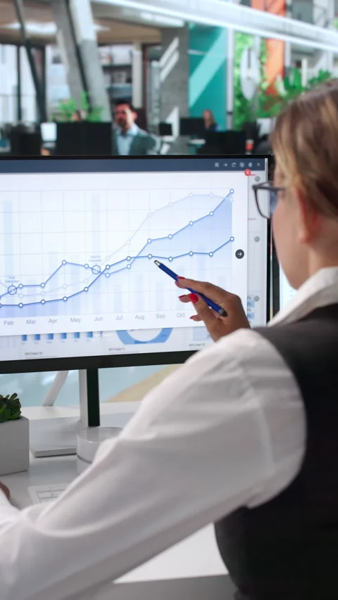 Data Analyst Reviewing Financial Dashboard Stock Footage 341002309
