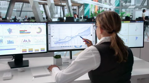 Data Analyst Reviewing Financial Dashboard Stock Footage 342969719