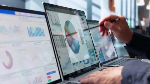 Data Analyst Reviewing Financial Dashboard On Laptop Stock Footage 343884028