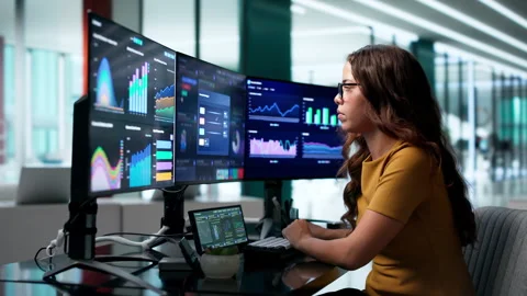 Data Analyst Reviewing Financial Dashboard For Market Performance Insights Stock Footage 345332946