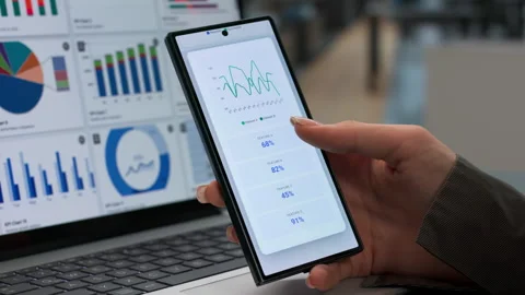 Data Analyst Reviewing Financial Dashboard On Laptop While 库存影片 345859394