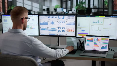 Data Analyst Reviewing Financial Dashboard On Laptop Stock Footage 346923918
