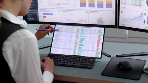 Data Analyst Reviewing Financial Dashboards On Laptop Stock Footage 341001306