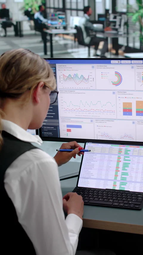 Data Analyst Reviewing Financial Dashboards On Laptop Stock Footage 341001958