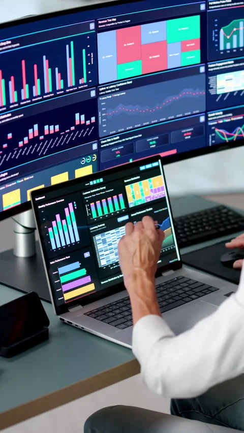 Data Analyst Reviewing Financial KPIs 動画素材 345856310