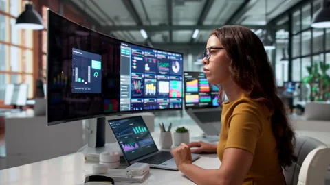 Data Analyst Reviewing High-performance Financial Dashboard Stock Footage 345332254