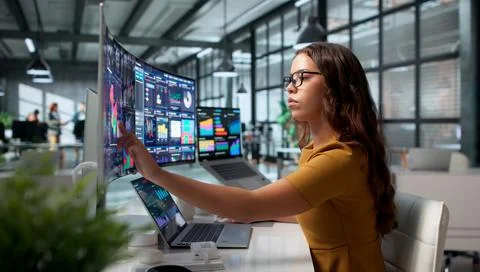 Data Analyst Reviewing Real-time Financial Dashboard On Laptop Screen Careful Stock Photos
