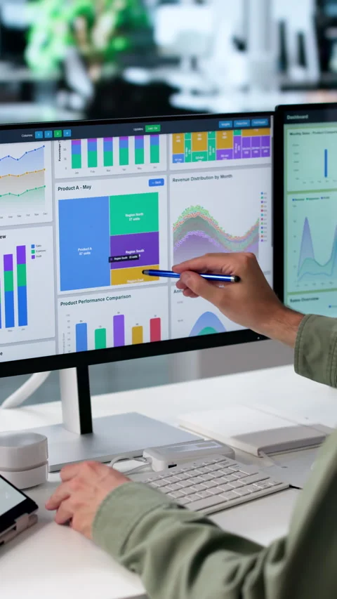 Data Analyst Reviews Financial Dashboard On Laptop Stock Footage 342966329