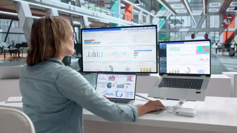 Data Analyst Studies Dashboard Metrics While Working On Laptop Stock Footage 342967621