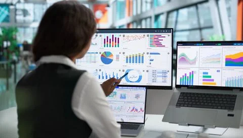 Data Analyst Studies Market Trends On Laptop, Planning Strategic Investments. Stock Photos