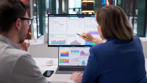 Data Analyst Studying Business Dashboard On Desktop Computer Stock Footage 332907197