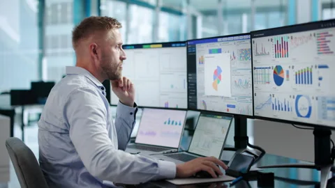 Data Analyst Studying Financial Dashboard Stock Footage 347895678
