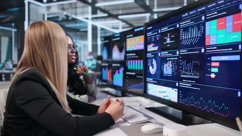 Data Analysts Review Financial Dashboards Together Stock Footage 342981675