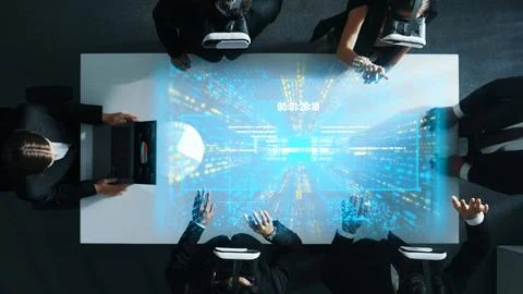 Data analysts wearing VR headset with hologram of finance graph. Directorate. Stock Photos