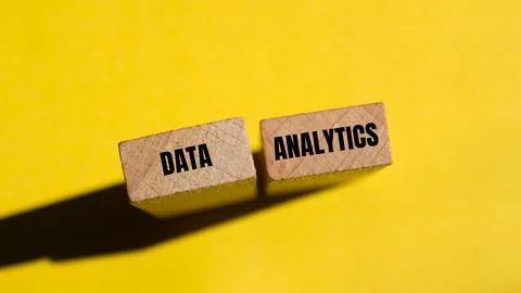 Data analytics message written on wooden blocks with yellow background. Conce Stock Photos