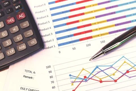 Data analyzing with calculator and pen. from charts and graph to find out t.. Stock Photos