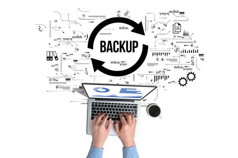 Data backup for data recovery to original or new location. The person is working Stock Photos