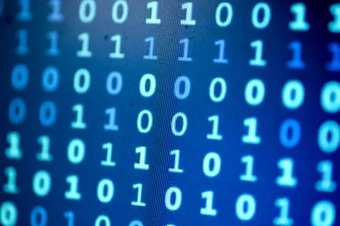 Data bits computer bits blue background of screen monitor. Stock Photos