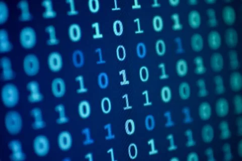 Data bits computer bits blue background of screen monitor. Stock Photos