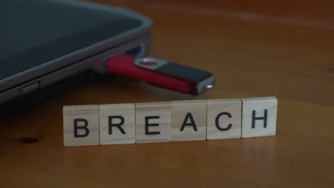 Data Breach Concept With Hand Placing Final Letter H In Breach Word Beside Usb D Stock Footage 343578590