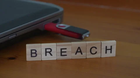 Data Breach Concept With Hand Placing Final Letter H In Breach Word Beside Usb D Stock Footage 343578731