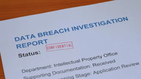 Data Breach Investigation Report Confidential Stamp Coming Down on Form Stock Footage 342937043