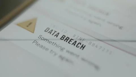 Data breach warning with yellow triangle alert icon Stock Footage 334931410