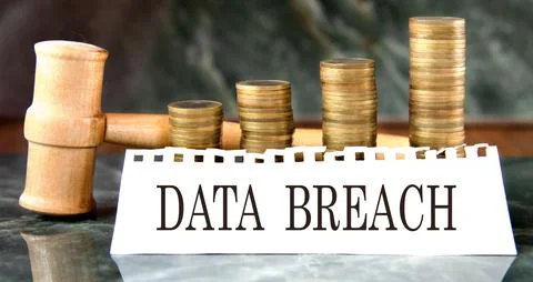 DATA BREACH - words on a white sheet with a judge's gavel and a stack of co.. Stockfoto's