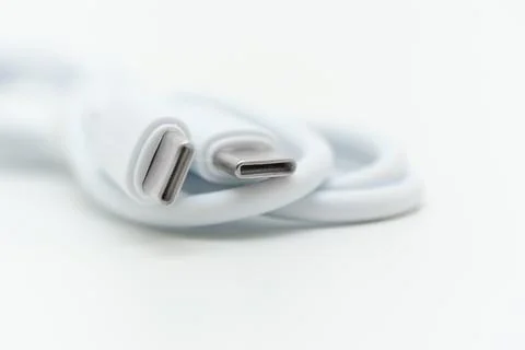 Data cable connects devices for charging and data transfer Stock Photos
