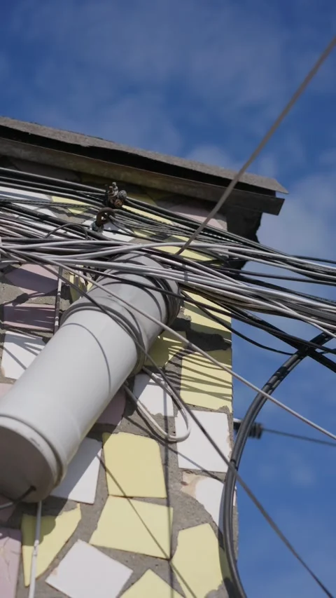 Data Cables Bundling Into Protective Equipment Housing on Rooftop Wall Stock Footage 347544016