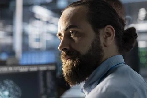 Data center admin doing software updates, verifying neural network parameters Stock Photos