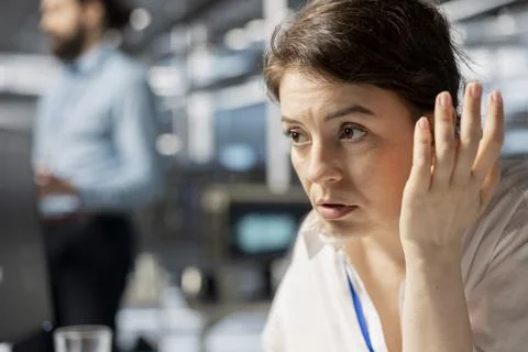 Data center admin inspecting infrastructure, doing maintenance tasks, close up 写真素材